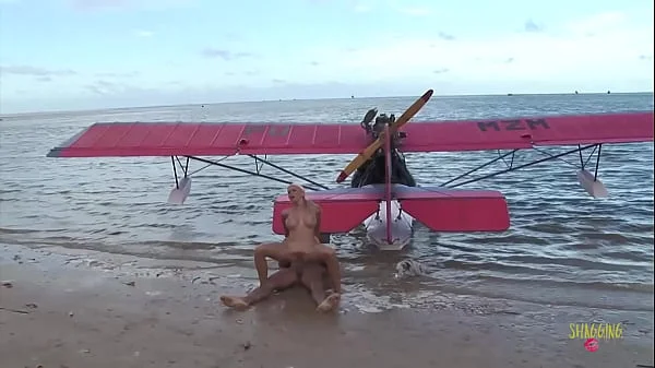 Passionate fucking on the beach with a stunning blonde with big tits