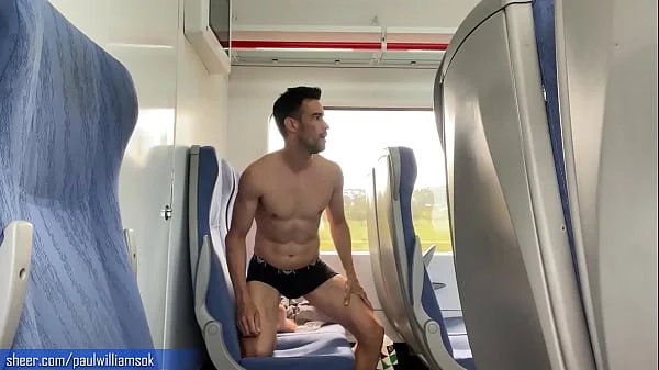 Sexy tanned man travelling naked by train. Very risky public nudity