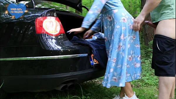 A beauty caught masturbating fucks a stranger right next to the car