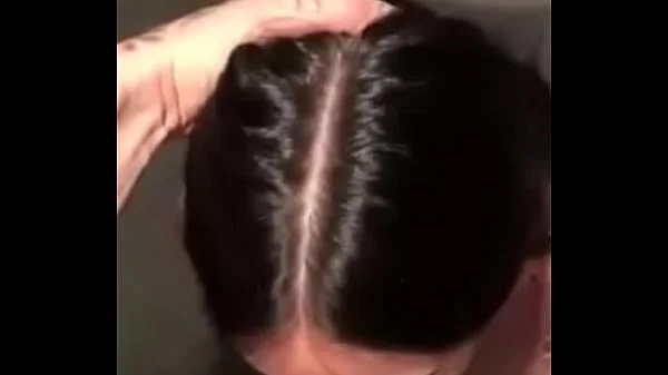 Submissive brunette sucking a giant cock