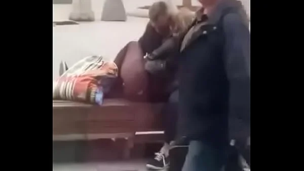 Stupid blonde gives blowjob in public