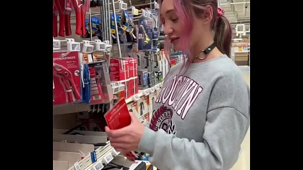 Busty babe flashes her tits all over the home store