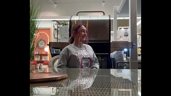 Busty babe flashes her tits all over the home store