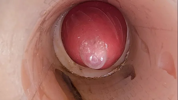 The camera in the deep pussy records a huge ejaculation of sperm into the condom
