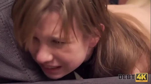 Debt4k. Red-haired miss reaches orgasm and returns the debt at the same time