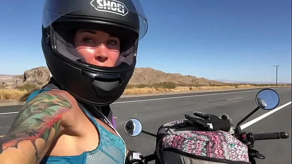 felicity feline riding on aprilia tuono motorcycle