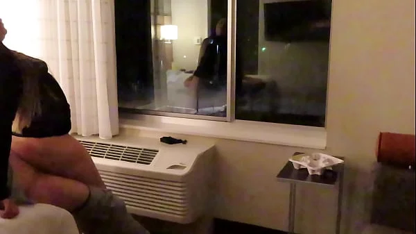 Having fun wearing a see through short dress in hotel public areas