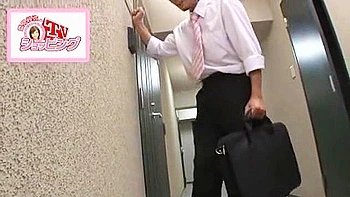 She licks him while he's naked, and swallows his semen into her mouth.