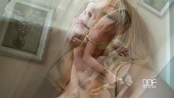 Pierced teen naked in armchair