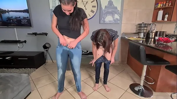 Two piss sluts soaking and wetting their jeans with pee and starts getting undressed afterwards