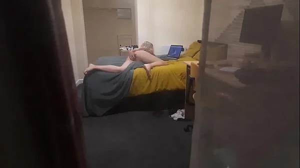 Girl caught masturbating through the window