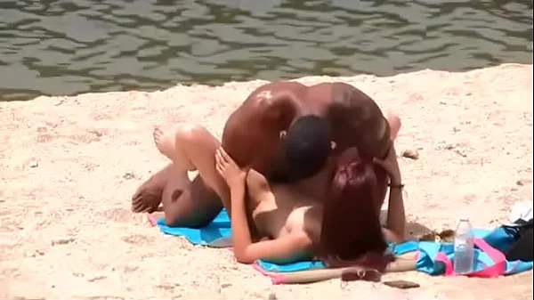 Black dude looks for horny babes at the nude beach and bangs one of 'em