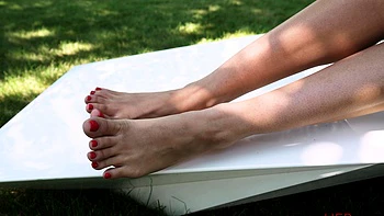 Kinky Babe Megan Love Teasing With Her Feet Outdoors