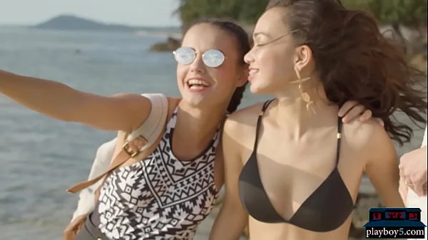 Four pretty lesbian girlfriends get naked on the beach