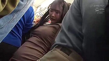 On the train, she is surrounded by men, groping her body and being penetrated deep in her throat.