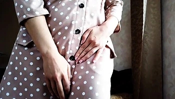 Gorgeous babe with big tits teases in a sexy BDSM dress.