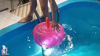 Gorgeous mature blonde Jitka is touching her shaved pussy in the pool