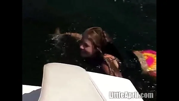 Sexy teen Little April playing with her snatch outdoors in rubber boat