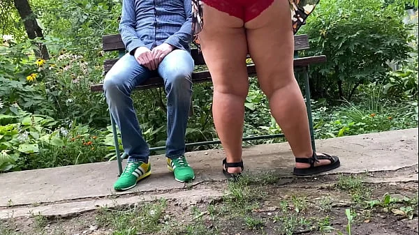 MILF pissing with her legs spread wide I get excited and look