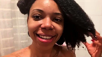 Ebony babe with big tits takes shower solo