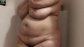 Busty Curly Brunette with Huge Tits Fucks on Couch