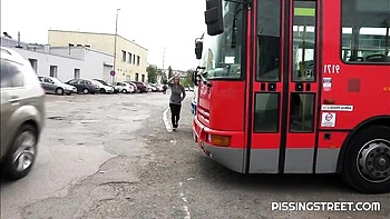 Crazy solo pissing on the pave with a hot short-haired girlfriend Suzie
