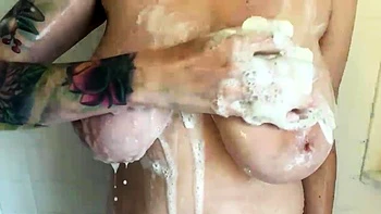 Blonde mature with big boobs masturbates in bed